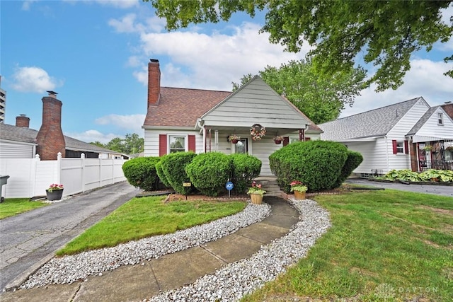 1064 Wilmington Ave, Dayton, OH 45420 - bungalow-style house with covered porch and a chimney