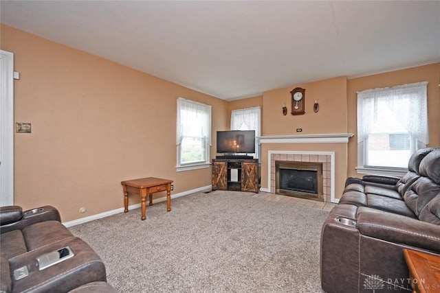 1064 Wilmington Ave, Dayton, OH 45420 - carpeted living room with baseboards and a tile fireplace