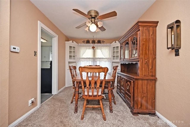 1064 Wilmington Ave, Dayton, OH 45420 - dining area with a ceiling fan, light carpet, baseboards, and a textured wall