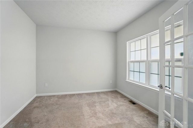 344 Warm Springs Dr, Fairborn, OH 45324 - spare room with carpet floors, baseboards, and a textured ceiling