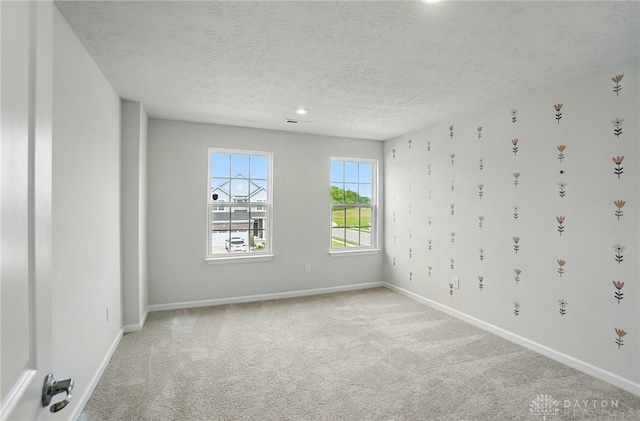 344 Warm Springs Dr, Fairborn, OH 45324 - spare room featuring baseboards, light carpet, a textured ceiling, and recessed lighting