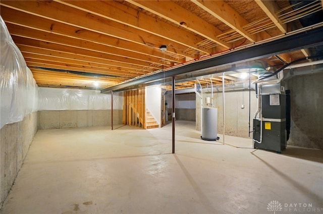 344 Warm Springs Dr, Fairborn, OH 45324 - unfinished below grade area with gas water heater, heating unit, and stairs