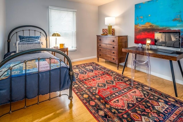 1126 Justin Ridge Way, Waynesville, OH 45068 - bedroom with wood finished floors, baseboards, and an office area
