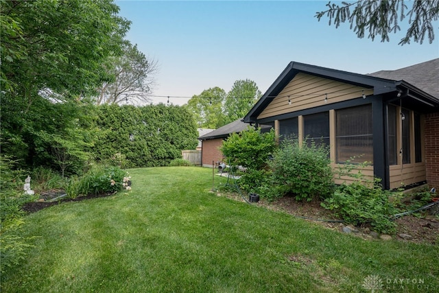 1126 Justin Ridge Way, Waynesville, OH 45068 - view of green lawn with a sunroom