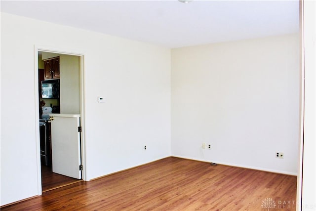 2589 Midvale St, Dayton, OH 45420 - unfurnished room with wood finished floors and baseboards
