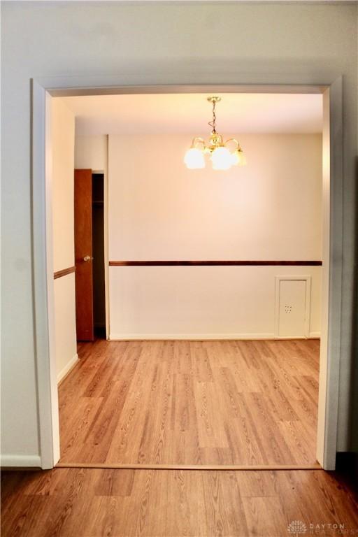 2589 Midvale St, Dayton, OH 45420 - unfurnished room featuring a chandelier and wood finished floors