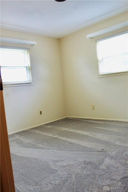 2589 Midvale St, Dayton, OH 45420 - carpeted empty room featuring baseboards