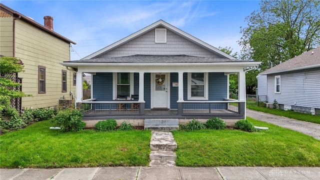 536 S St, Fairborn, OH 45324 - shotgun-style home with a front yard, a porch, and roof with shingles