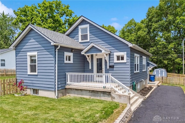 1153 Highridge Ave, Dayton, OH 45420 - bungalow-style house featuring a storage unit and roof with shingles