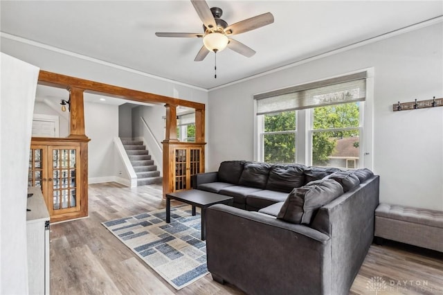 1153 Highridge Ave, Dayton, OH 45420 - living area featuring stairway, a ceiling fan, wood finished floors, and ornamental molding