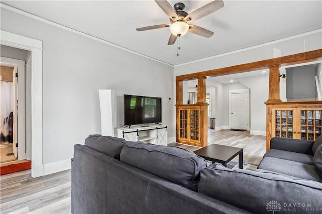 1153 Highridge Ave, Dayton, OH 45420 - living room featuring light wood-type flooring, ceiling fan, and crown molding
