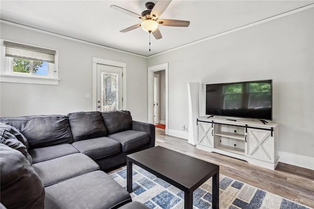 1153 Highridge Ave, Dayton, OH 45420 - living area with wood finished floors, ceiling fan, and crown molding