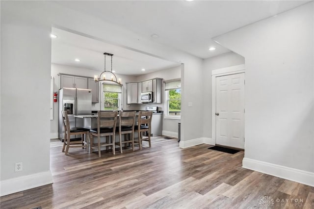 1153 Highridge Ave, Dayton, OH 45420 - dining space featuring wood finished floors, recessed lighting, and a chandelier