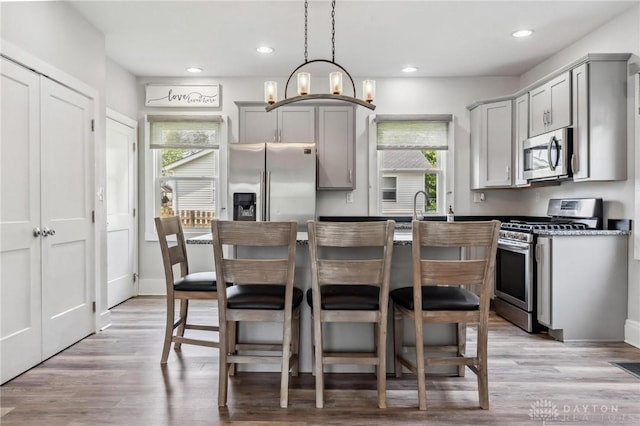 1153 Highridge Ave, Dayton, OH 45420 - kitchen featuring appliances with stainless steel finishes, gray cabinetry, light wood-type flooring, and recessed lighting