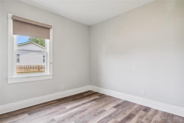 1153 Highridge Ave, Dayton, OH 45420 - empty room with wood finished floors and baseboards