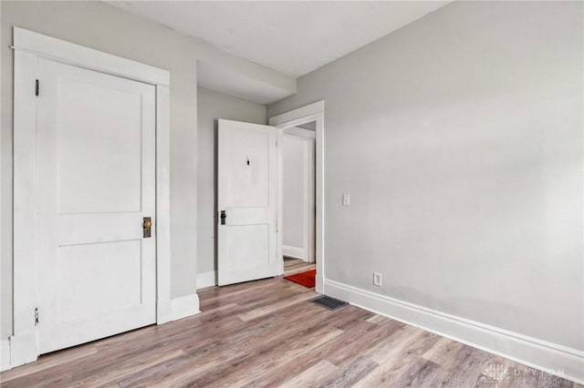 1153 Highridge Ave, Dayton, OH 45420 - unfurnished bedroom featuring light wood-style floors and baseboards