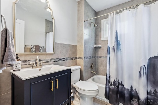 1153 Highridge Ave, Dayton, OH 45420 - bathroom with vanity, shower / bath combo, tile walls, and tile patterned flooring