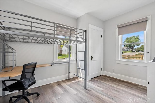 1153 Highridge Ave, Dayton, OH 45420 - unfurnished bedroom with wood finished floors and a desk