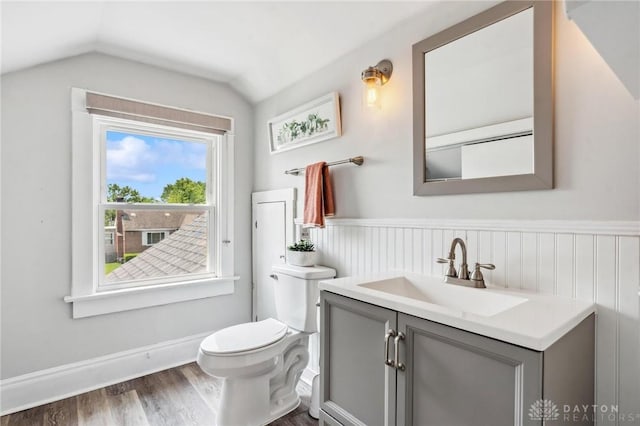 1153 Highridge Ave, Dayton, OH 45420 - half bath with vanity, vaulted ceiling, wood finished floors, and a wainscoted wall