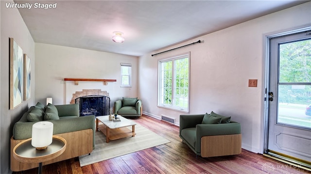 344 Triangle Ave, Oakwood, OH 45419 - living room featuring a fireplace, wood finished floors, and baseboards
