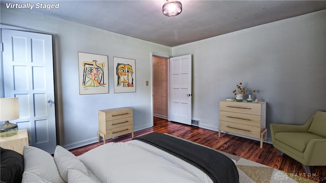 344 Triangle Ave, Oakwood, OH 45419 - bedroom featuring dark wood finished floors and baseboards