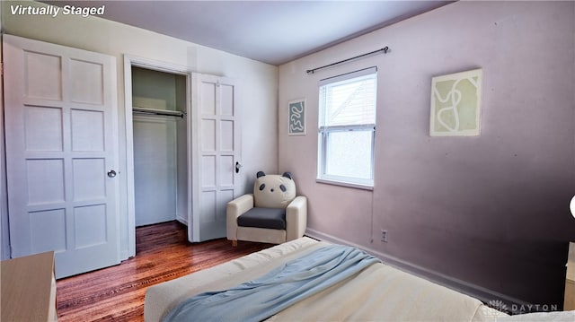 344 Triangle Ave, Oakwood, OH 45419 - bedroom featuring wood finished floors, a closet, and baseboards