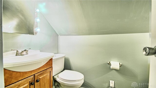 344 Triangle Ave, Oakwood, OH 45419 - half bath with lofted ceiling, toilet, and vanity