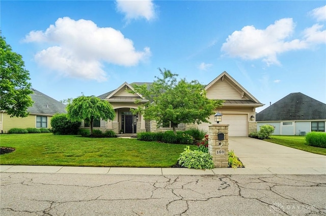 160 Harbour Dr, Springboro, OH 45066 - view of front of property with concrete driveway, a front yard, and a garage