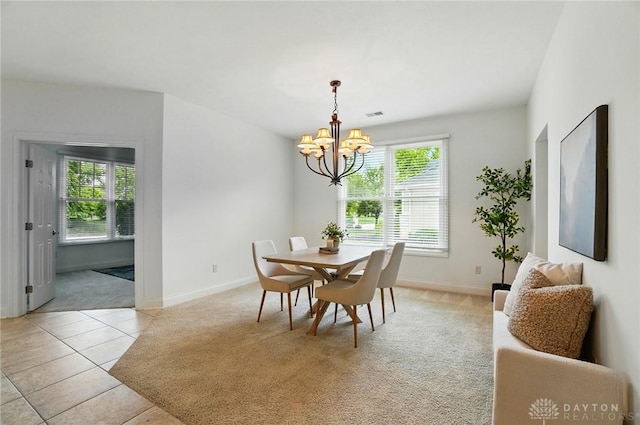 160 Harbour Dr, Springboro, OH 45066 - dining room with a chandelier, light colored carpet, healthy amount of natural light, and baseboards