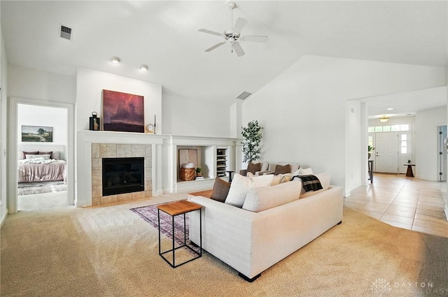 160 Harbour Dr, Springboro, OH 45066 - living room featuring ceiling fan, carpet flooring, a fireplace, and high vaulted ceiling