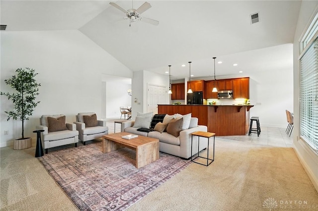160 Harbour Dr, Springboro, OH 45066 - living room with light carpet, high vaulted ceiling, ceiling fan, recessed lighting, and plenty of natural light