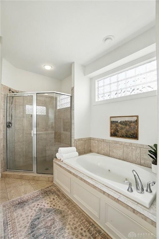 160 Harbour Dr, Springboro, OH 45066 - bathroom with a whirlpool tub, a stall shower, and tile patterned floors