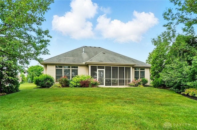160 Harbour Dr, Springboro, OH 45066 - rear view of house featuring a lawn and a sunroom