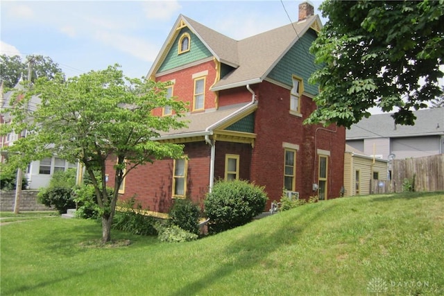 1600 Wayne Ave, Dayton, OH 45410 - view of property exterior featuring a chimney and brick siding