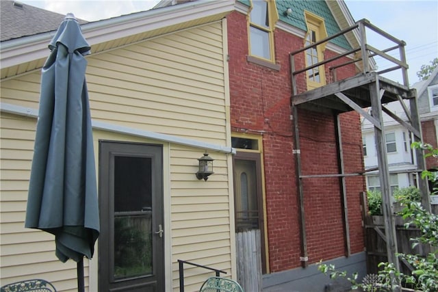 1600 Wayne Ave, Dayton, OH 45410 - rear view of property with brick siding and a balcony
