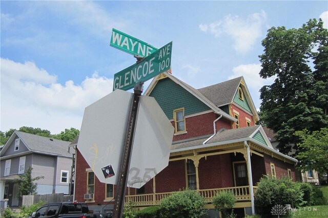 1600 Wayne Ave, Dayton, OH 45410 - victorian house with brick siding, covered porch, and a shingled roof