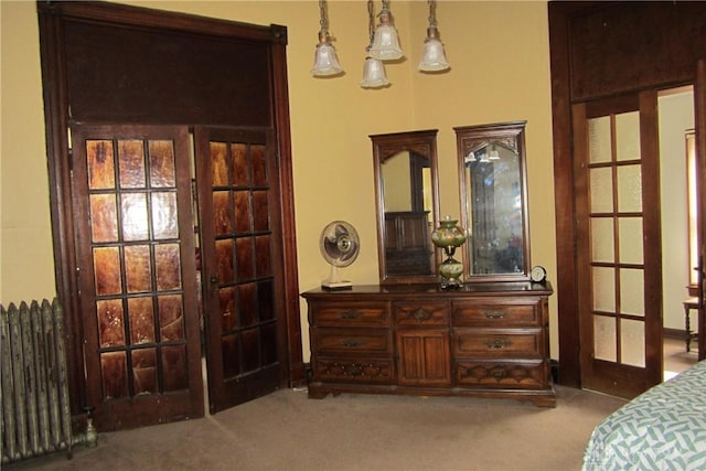 1600 Wayne Ave, Dayton, OH 45410 - bedroom featuring radiator heating unit, carpet floors, and french doors