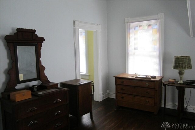 1600 Wayne Ave, Dayton, OH 45410 - bedroom with dark wood-style floors and multiple windows