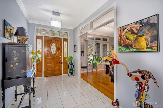 1668 Nichole Ct, Hamilton, OH 45013 - entrance foyer with ornamental molding, light tile patterned flooring, and baseboards
