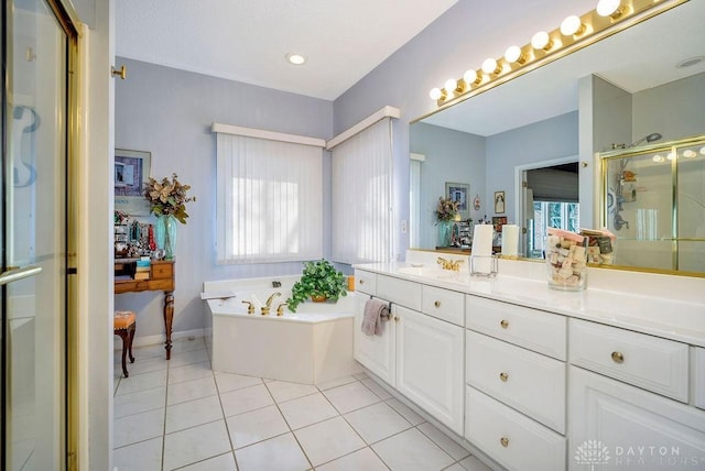1668 Nichole Ct, Hamilton, OH 45013 - bathroom with healthy amount of natural light, a stall shower, a garden tub, and tile patterned flooring