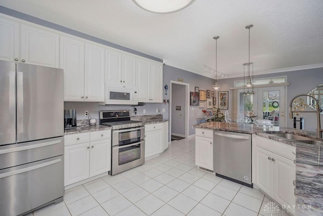 1668 Nichole Ct, Hamilton, OH 45013 - kitchen with stainless steel appliances, a sink, white cabinetry, ornamental molding, and light stone countertops