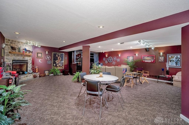 1668 Nichole Ct, Hamilton, OH 45013 - dining space featuring carpet floors, a fireplace, recessed lighting, and a textured ceiling