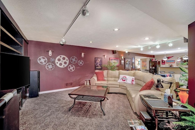 1668 Nichole Ct, Hamilton, OH 45013 - living area featuring a textured ceiling, carpet, baseboards, recessed lighting, and rail lighting