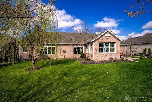 1668 Nichole Ct, Hamilton, OH 45013 - rear view of property with brick siding and a lawn