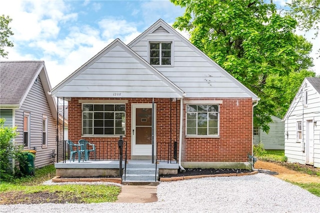 1208 Hale Ave, Dayton, OH 45419 - bungalow featuring brick siding and a porch