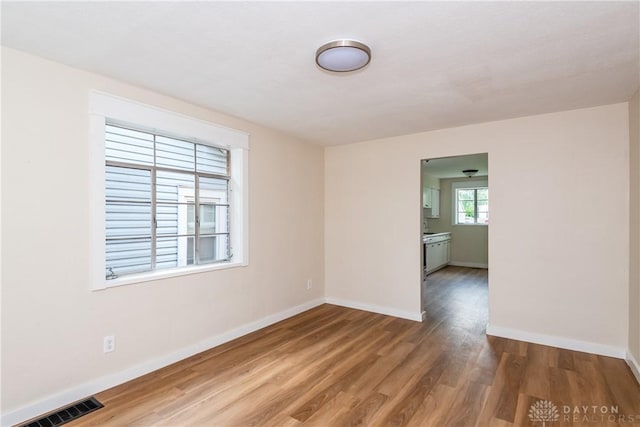 1208 Hale Ave, Dayton, OH 45419 - spare room with baseboards and wood finished floors