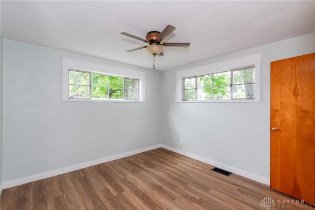 1208 Hale Ave, Dayton, OH 45419 - unfurnished room featuring baseboards, wood finished floors, and ceiling fan