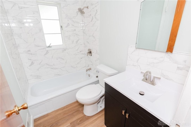1208 Hale Ave, Dayton, OH 45419 - bathroom with vanity, toilet, shower / bath combination, wood finished floors, and decorative backsplash