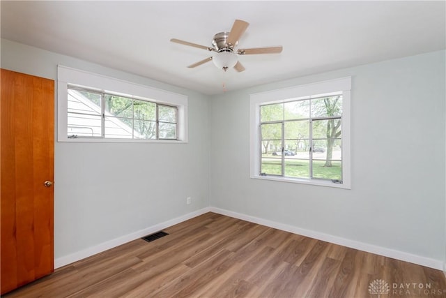 1208 Hale Ave, Dayton, OH 45419 - spare room featuring plenty of natural light, wood finished floors, baseboards, and ceiling fan