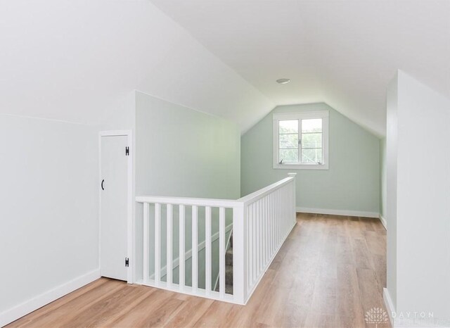 1208 Hale Ave, Dayton, OH 45419 - additional living space featuring wood finished floors, vaulted ceiling, and baseboards